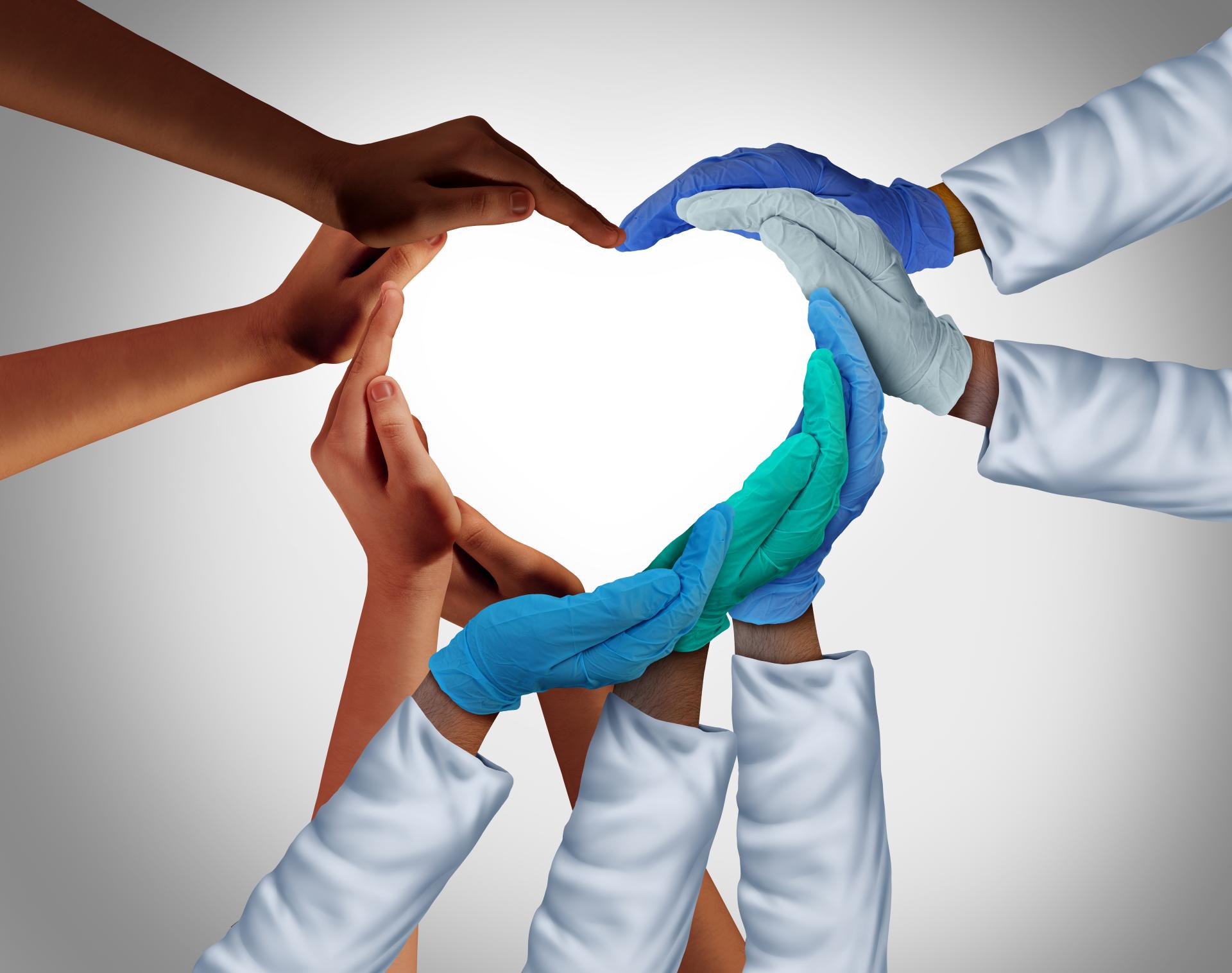 Zorg-en welzijnswerkers vormen een hart met hun handen